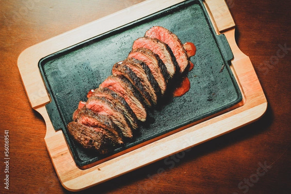 Fototapeta Barbecue, Get ready for a sizzling summer with this mouthwatering barbecue feast! Our juicy meats are cooked to perfection over an open flame, infusing them with smoky flavor that will leave your tast