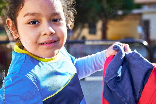 Obraz latin girl football player in a sport suit with getting ready for a elementary children soccer match