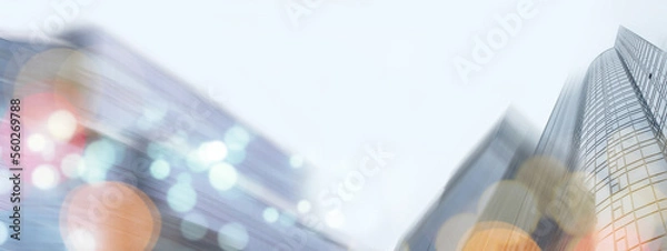 Obraz Abstract business modern city urban futuristic architecture background, motion blur, reflection in glass of high rise skyscraper facade, toned blue picture with bokeh. Real estate concept