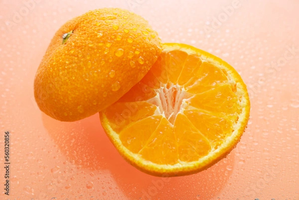 Fototapeta オレンジ色の背景でみかん（オレンジ）を撮影した写真