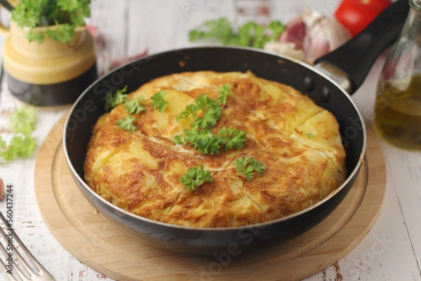 Obraz Traditional Spanish dish tortilla on the table	