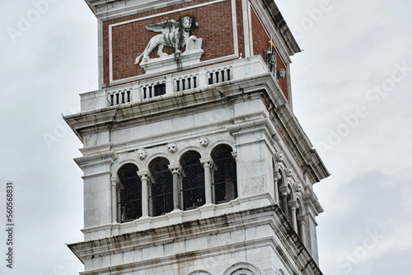 Fototapeta MAY 20, 2017 - VENICE, ITALY: Close up showing details of the top of the bell tower at Saint Mark's Square, Campanile di San Marco.