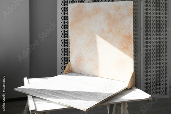 Fototapeta Double-sided backdrop on table in photo studio