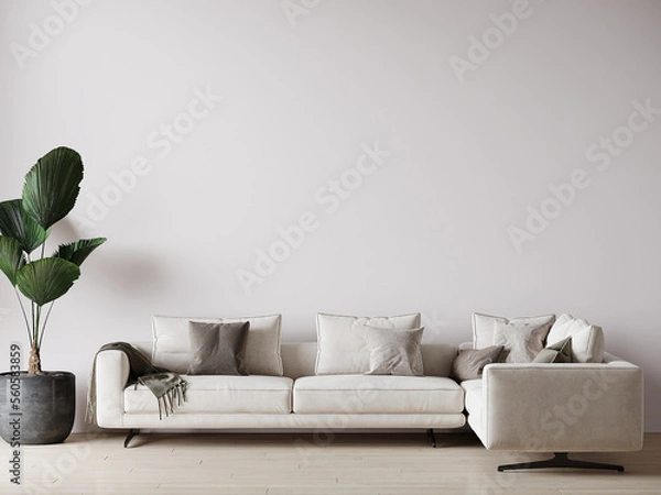 Obraz Living room in a light tone - ivory, white, milky color. Modern design of the room with a large accent sofa in the center. Empty white wall background. 3d rendering