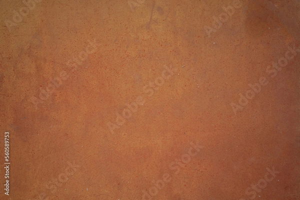 Fototapeta Texture of a rusting substrate. Coarse pored background in tangerine red orange.
