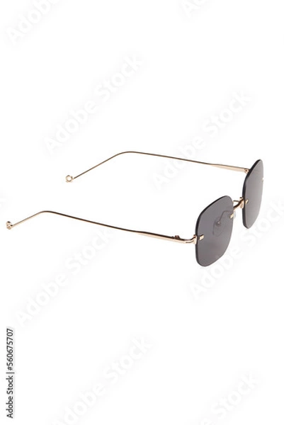 Fototapeta Close-up shot of fashion rimless glasses with black lenses and with thin temples. Rectangular glasses without frames are isolated on a white background. Side view.