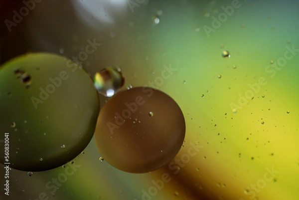 Fototapeta Bubbles of oil in the water. Balloons, eyes, balls, colors.
Abstraction - Cosmos - Planets.
