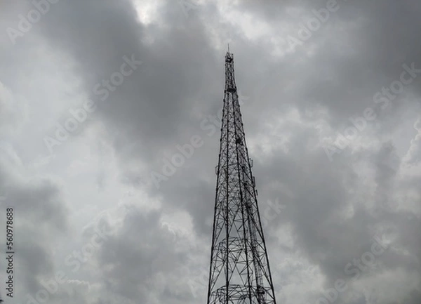 Obraz A mobile tower in a cloudy sky