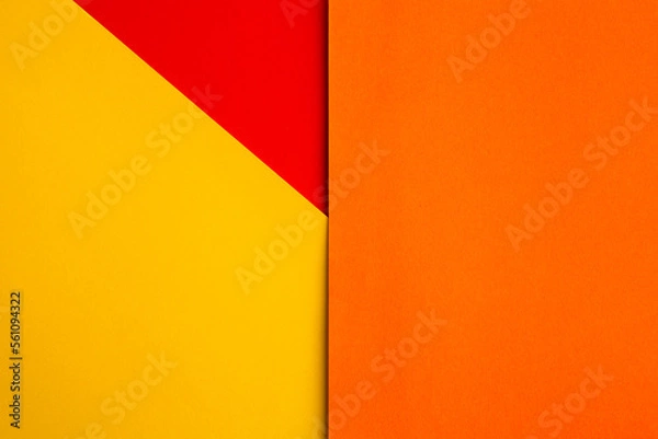 Fototapeta Paper color yellow, orange and red abstract background. Multicolored backdrop from colored cardboard. Paper colorful background. Texture for design.