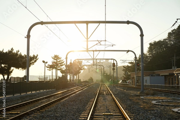 Fototapeta railway crossing with morning sun at South Korea.