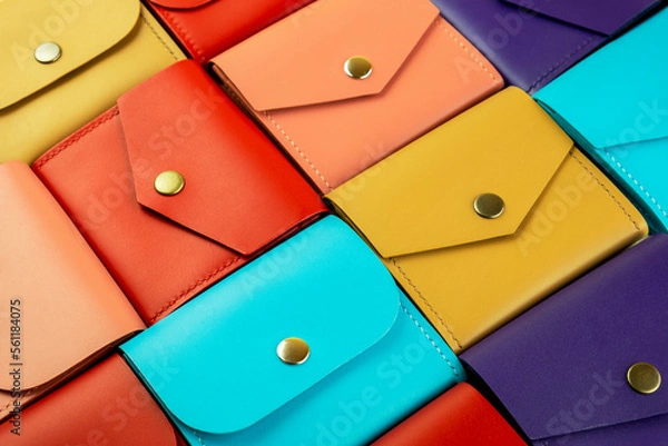 Fototapeta bright colored leather wallets lie close to each other