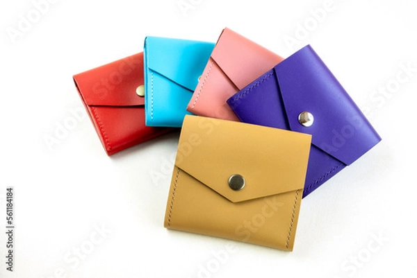 Fototapeta bright colored leather wallets. on a white background