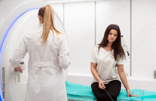 Fototapeta Medical CT or MRI Scan with a patient in the modern hospital laboratory. Interior of radiography department. Technologically advanced equipment in white room. Magnetic resonance diagnostics machine