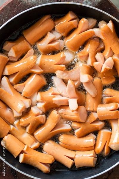 Fototapeta making hot dog