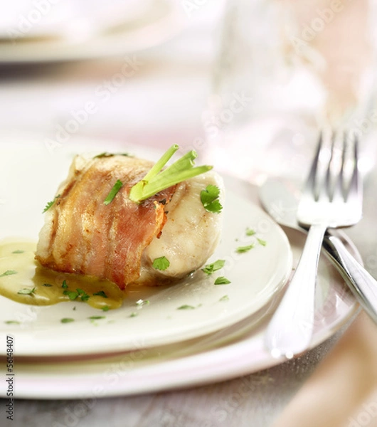 Fototapeta monkfish filet wraped in bacon