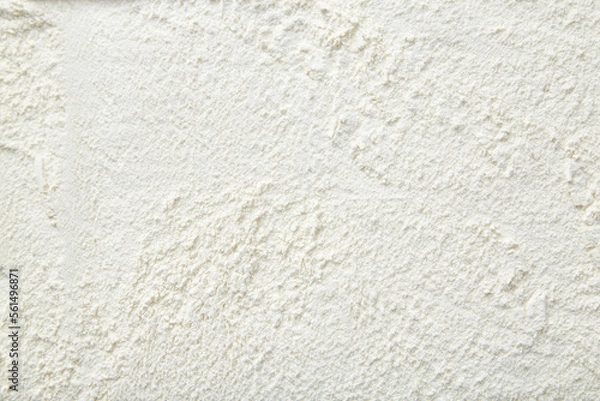 Fototapeta Rice flour close up background. A pile of Rice flour on a white background. Spilled flour. Flour texture