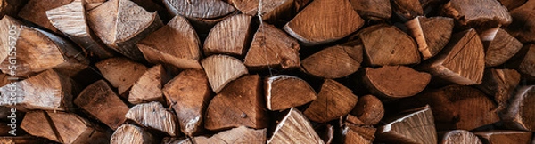 Fototapeta Horizontal image Chopped firewood is stacked in a big pile