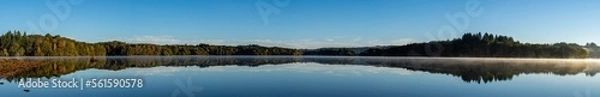 Fototapeta Panoramic of Lac de Saint Pardoux at sunrise in autumn with fog on the water