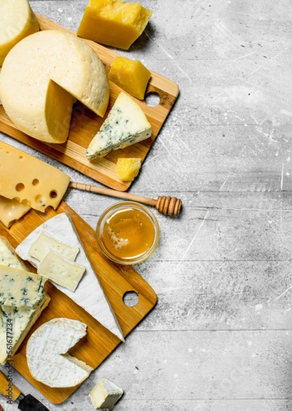 Fototapeta Different kinds of cheese with honey.