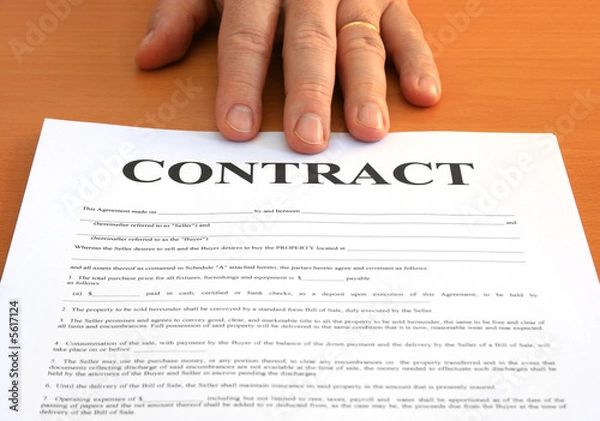 Obraz Male hand presents a contract document