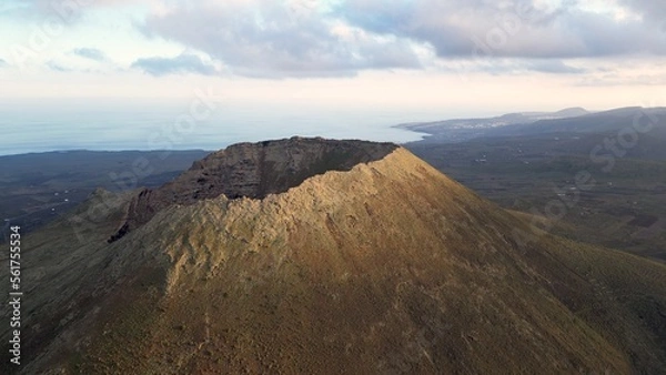 Fototapeta Drone aerial view of Volcán de La Corona is a 609 meters high extinct volcano on the Canary Island of Lanzarote, close to  Yé and  Haría in Canaries island , Spain - crater volcano view 