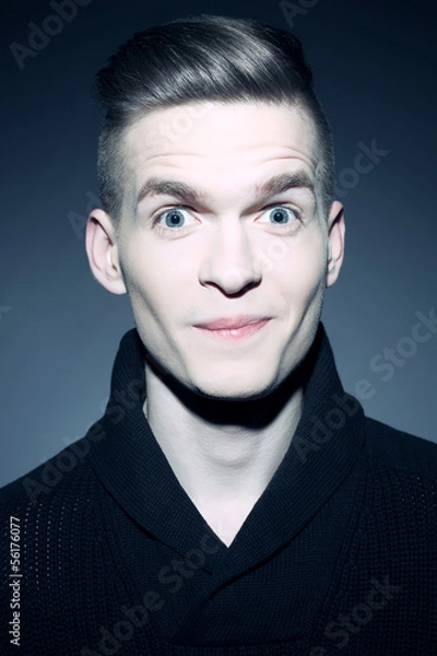 Fototapeta Fashion portrait of a smiling elegant young and handsome man