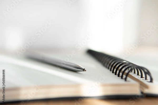 Fototapeta pen on notebook close-up