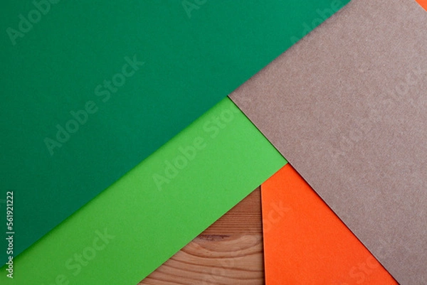 Fototapeta Paper green, orange, brown kraft and wood texture, empty background, geometrically located. Creative plain concept slight. Color blank for presentations, copy space.