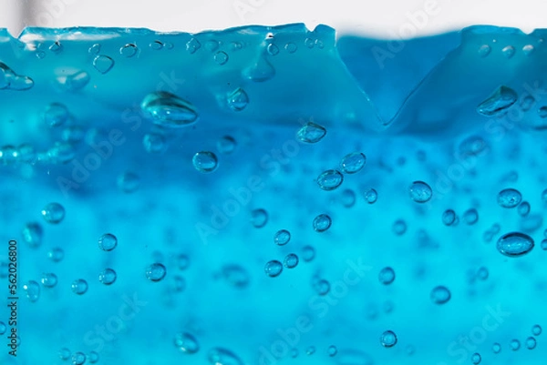 Fototapeta fake wave, selective focus small bubble floating in blue gel like under the ocean.