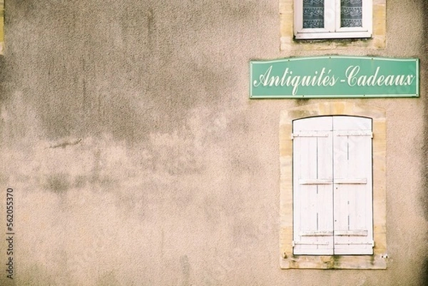 Obraz old window in a wall with a plaque