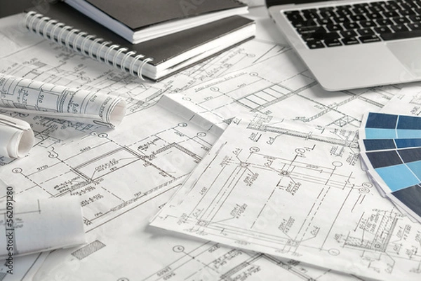 Obraz Architects concept, engineer architect designer freelance work on start-up project drawing, construction plan. architect design working drawing sketch plans blueprints and making construction model