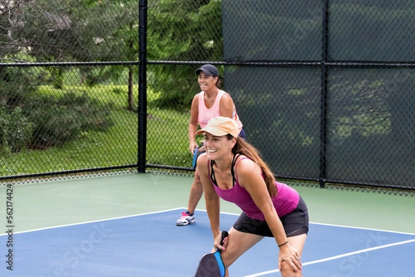 Obraz Two pickleball players prepare for action