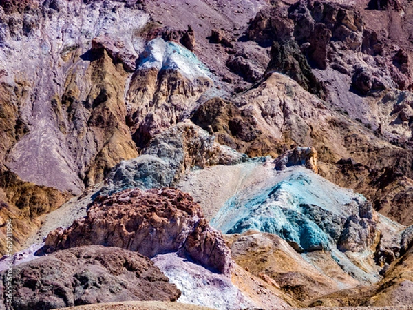 Fototapeta slopes at Artists Palette in Death Valley, California. Various mineral pigments have colored the volcanic deposits found here