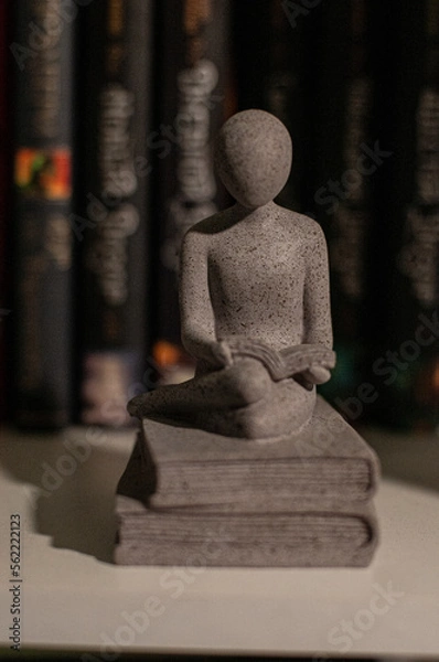 Obraz Figurine with a book