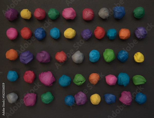 Obraz plastic mass for modeling colored on gray background.