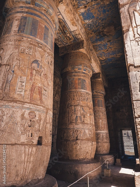 Fototapeta Colourful columns with hieroglyphs in Habu Temple, Luxor, Egypt.
