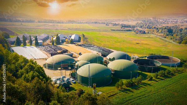 Fototapeta Biogas plant and farm in fields. Renewable energy from biomass. Agriculture prepared for Green Deal. Aerial view to Czech industry. Sustainable development in European Union.