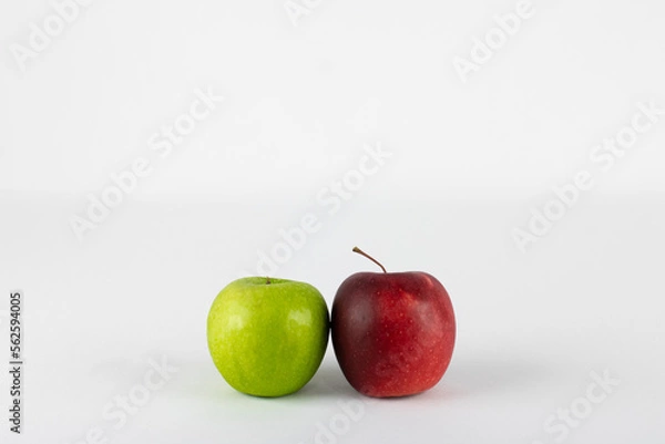 Fototapeta Red and green apple on white background