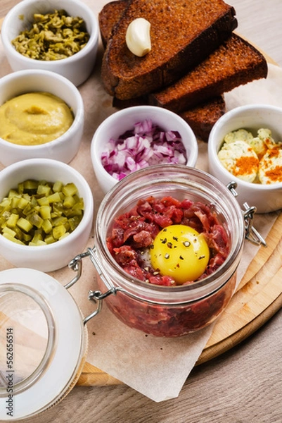 Fototapeta beef tartare with egg and dressing