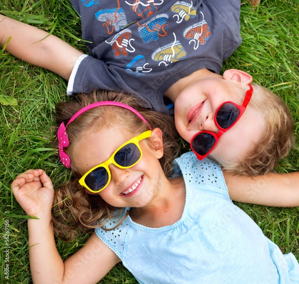 Obraz Picture presenting kids relaxinng on the grass