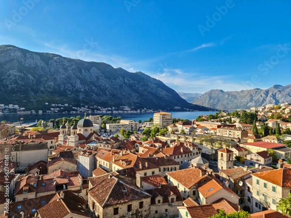 Obraz Aerial view of Kotor bay, town and harbour in sunny summer at Adriatic Mediterranean Sea, Montenegro, Balkan, Europe. Fjord winding along coastal towns. Lovcen park. Seen from Kotor fortress wall
