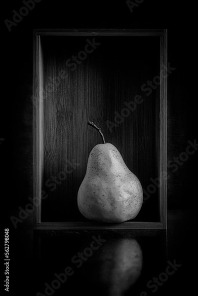 Fototapeta Isolated Pear in Bamboo Box presented in Black and White