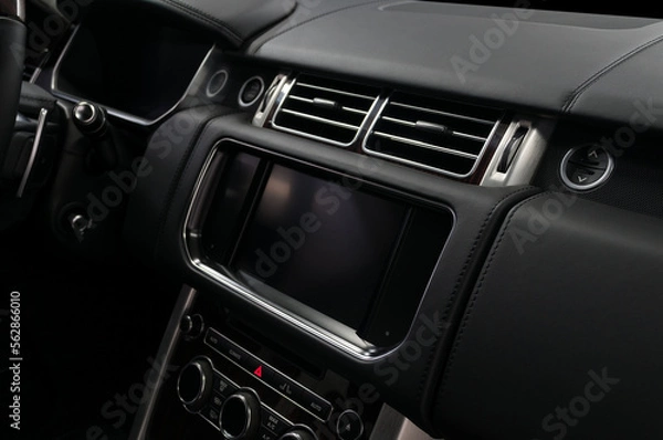 Obraz Car interior detail. Panel with multimedia screen, control buttons and air conditioner holes.