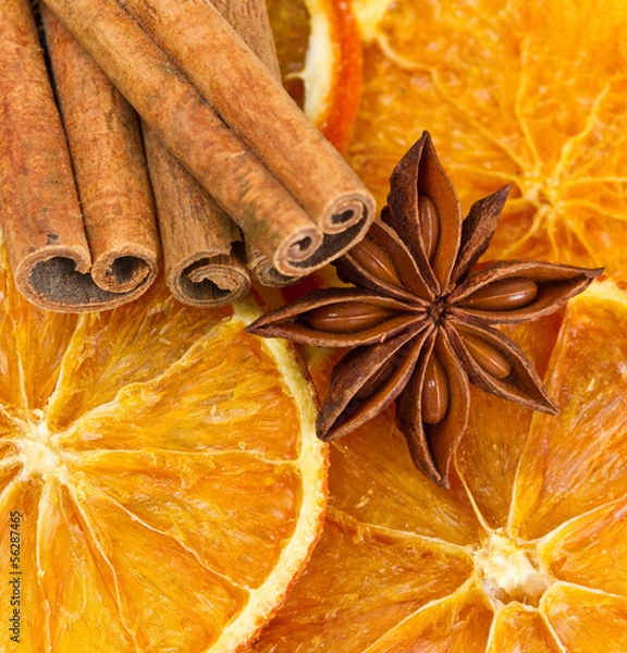 Fototapeta Cinnamon sticks, star anise and dried orange cuts