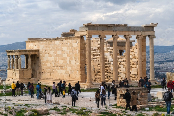 Fototapeta  Erechtheion Temple (Erechtheum) with the Caryatids at the archaeological site of Acropolis. The temple was dedicated to goddess Athena and god Poseidon