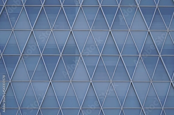 Fototapeta Geometric patterns on the windows of the building