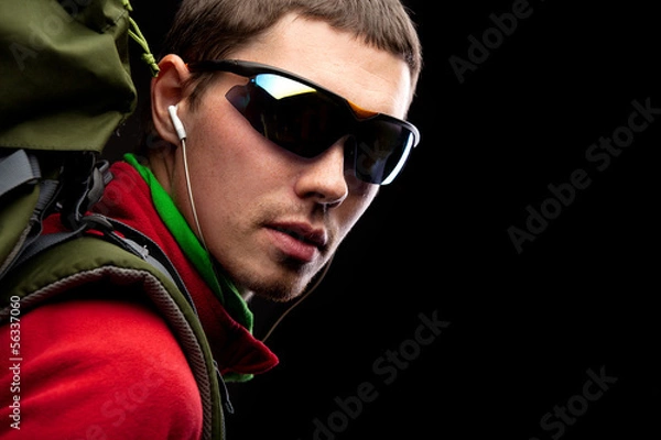 Fototapeta young man with backpack walking