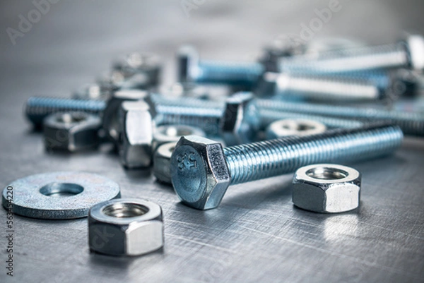 Fototapeta Working tool. Nuts and bolts on the table. 