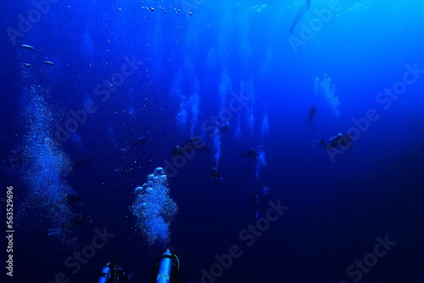 Obraz group of divers depth bubbles dive