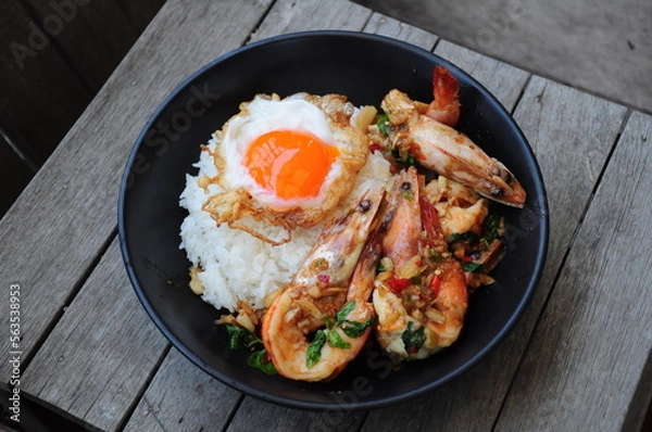 Fototapeta Stired Fry Shrimp with Thai Basil and Fried Egg with Rice